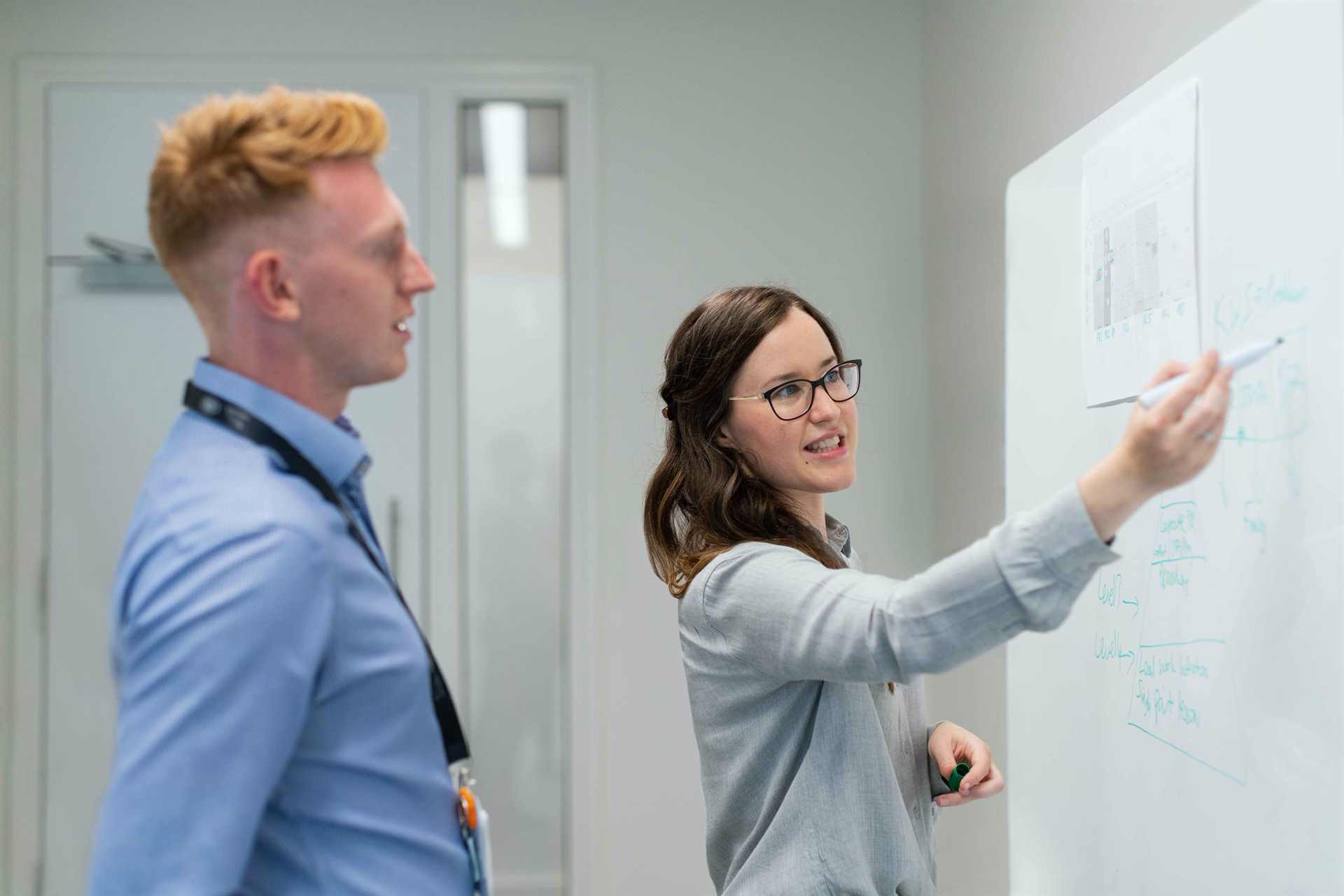 Image of two people discussing about their goals